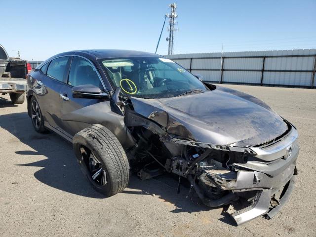 HONDA CIVIC TOUR 2016 with VIN 19XFC1F97GE211856 - Photo from auction