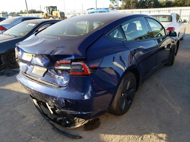 Photo 4 from auction – 2021 TESLA MODEL 3 with VIN 5YJ3E1EA9MF027372