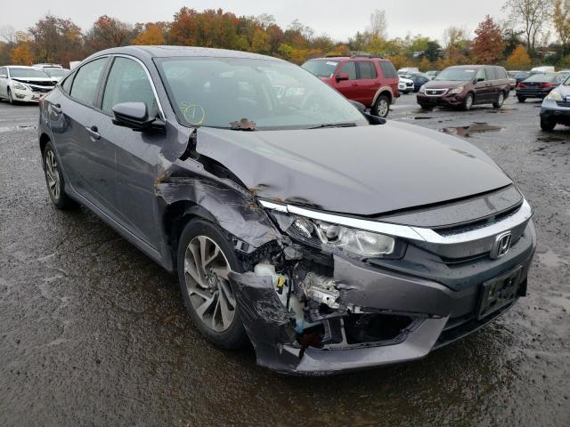 HONDA CIVIC EX 2018 with VIN 19XFC2F76JE203002 - Photo from auction