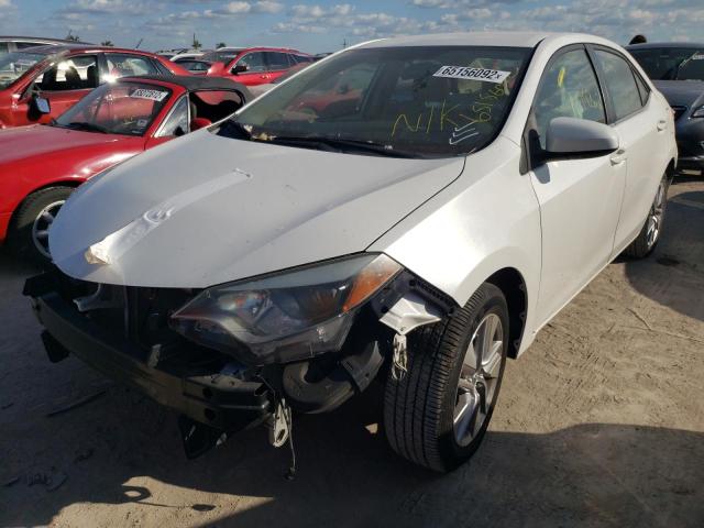 Photo 2 from auction – 2014 TOYOTA COROLLA EC with VIN 5YFBPRHE3EP058965