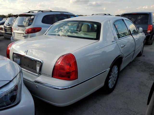 Photo 4 from auction – 2004 LINCOLN TOWN CAR E with VIN 1LNHM81W74Y660709