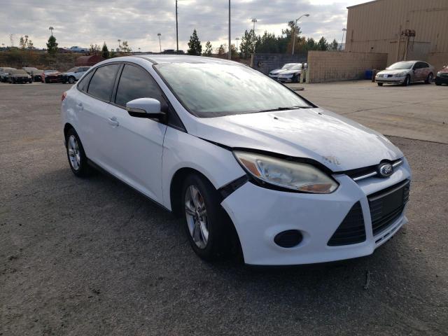 FORD FOCUS SE 2014 with VIN 1FADP3F24EL140510 - Photo from auction