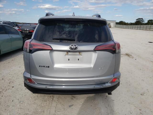 Photo 6 from auction – 2018 TOYOTA RAV4 LE with VIN 2T3BFREV0JW848036