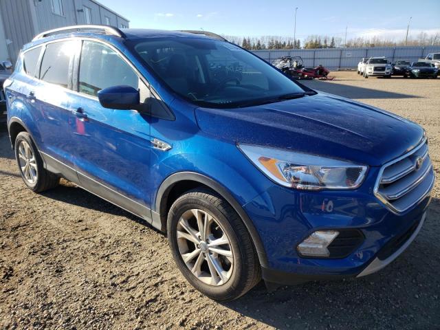 FORD ESCAPE SE 2018 with VIN 1FMCU9GD9JUC52267 - Photo from auction
