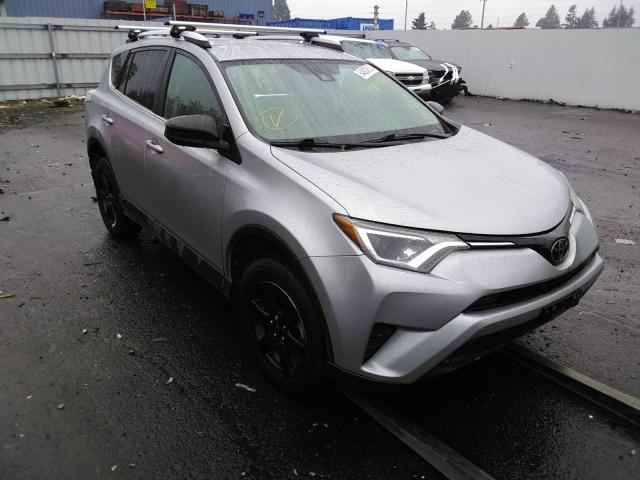 TOYOTA RAV4 LE 2018 with VIN 2T3ZFREV1JW469898 - Photo from auction