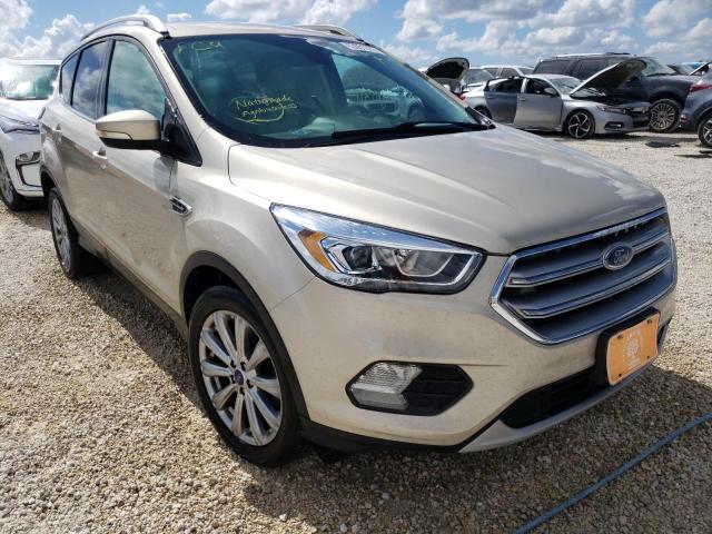 FORD ESCAPE TIT 2017 with VIN 1FMCU0J90HUC31706 - Photo from auction