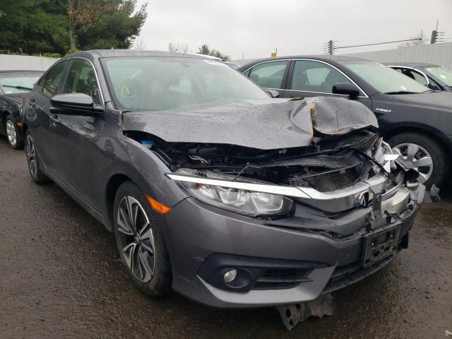 HONDA CIVIC EX 2018 with VIN JHMFC1F34JX037584 - Photo from auction