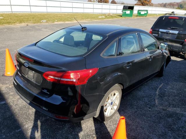 Photo 4 from auction – 2016 FORD FOCUS SE with VIN 1FADP3F20GL285708