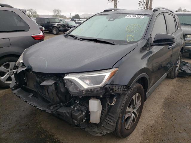Photo 2 from auction – 2018 TOYOTA RAV4 LE with VIN JTMZFREV9JD115849