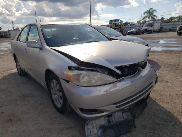 TOYOTA CAMRY LE 2004 with VIN 4T1BF30K84U584474 - Photo from auction