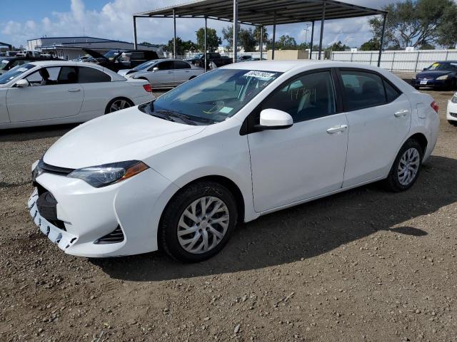 TOYOTA COROLLA L 2019 with VIN 5YFBURHE2KP932470 - Photo from auction