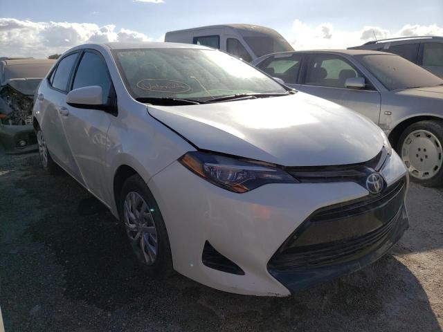TOYOTA COROLLA L 2018 with VIN 5YFBURHE9JP773607 - Photo from auction