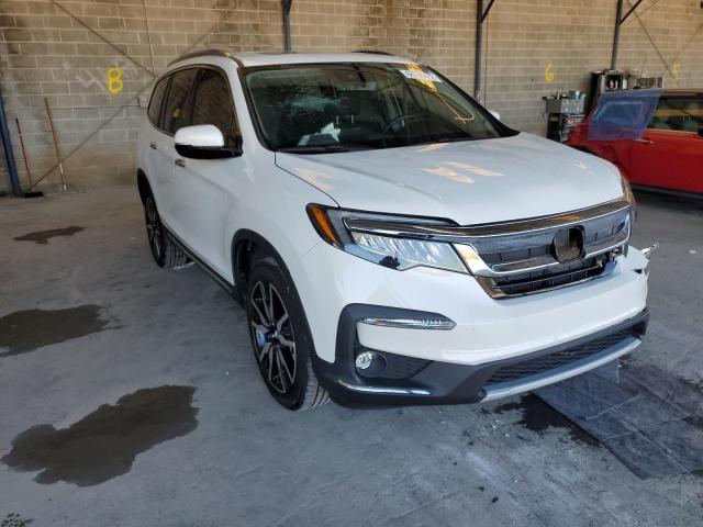 HONDA PILOT TOUR 2021 with VIN 5FNYF6H63MB034552 - Photo from auction