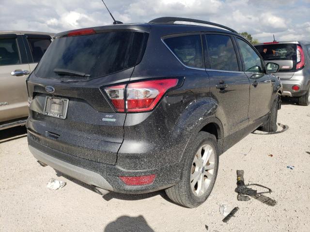 Photo 4 from auction – 2018 FORD ESCAPE SE with VIN 1FMCU0GD0JUA84496
