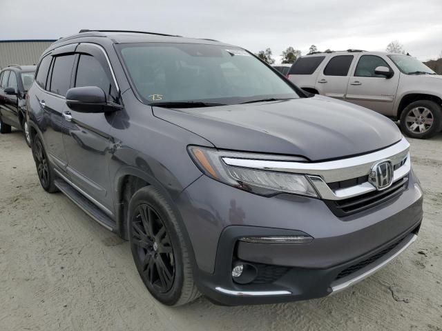 HONDA PILOT TOUR 2021 with VIN 5FNYF5H67MB030661 - Photo from auction