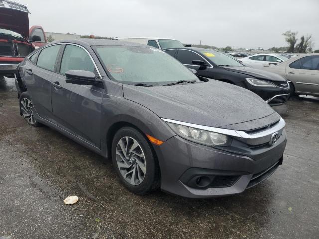 HONDA CIVIC EX 2018 with VIN 19XFC2F8XJE044185 - Photo from auction