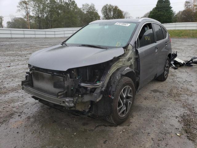 Photo 2 from auction – 2015 HONDA CR-V LX with VIN 2HKRM3H38FH556919