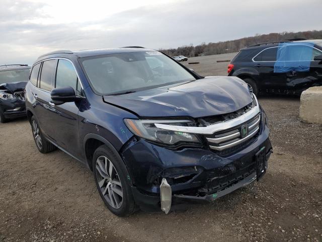 HONDA PILOT TOUR 2016 with VIN 5FNYF6H99GB097945 - Photo from auction
