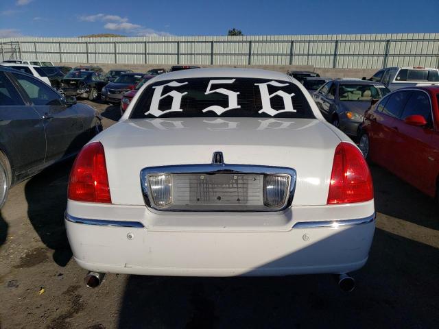 Photo 6 from auction – 2004 LINCOLN TOWN CAR E with VIN 1LNHM81W64Y649474