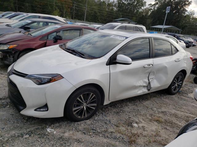 TOYOTA COROLLA L 2019 with VIN 5YFBURHE1KP875016 - Photo from auction