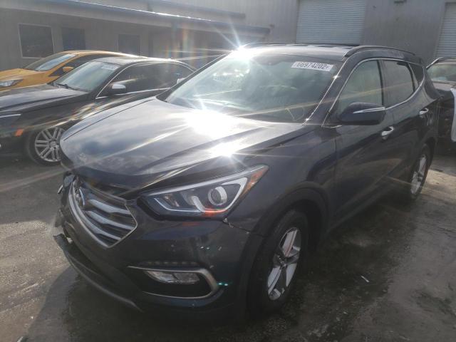 HYUNDAI SANTA FE 2018 with VIN 5NMZU3LB9HH051616 - Photo from auction