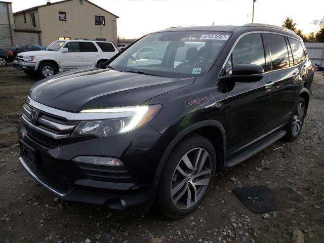 HONDA PILOT TOUR 2018 with VIN 5FNYF6H96JB036799 - Photo from auction