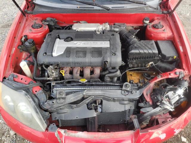Photo 11 from auction – 2004 HYUNDAI TIBURON with VIN KMHHM65DX4U150102
