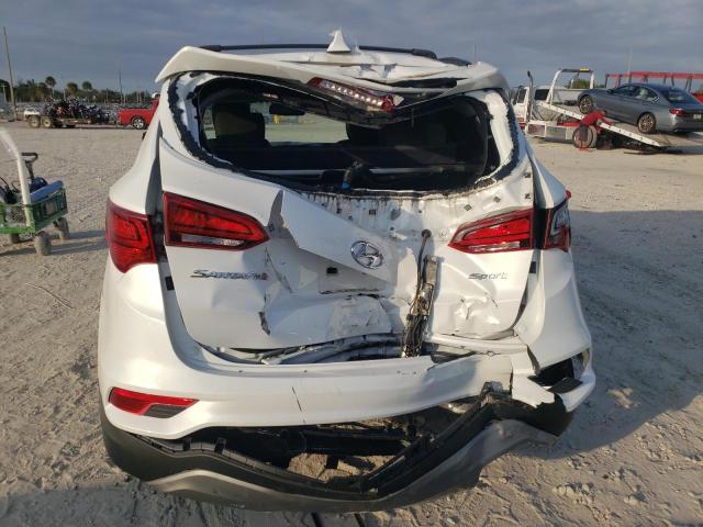 Photo 6 from auction – 2018 HYUNDAI SANTA FE S with VIN 5NMZU3LB1JH077343