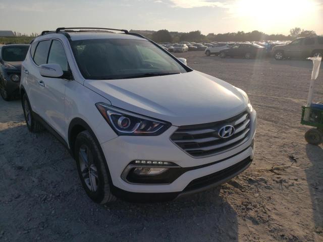 Photo 4 from auction – 2018 HYUNDAI SANTA FE S with VIN 5NMZU3LB1JH077343