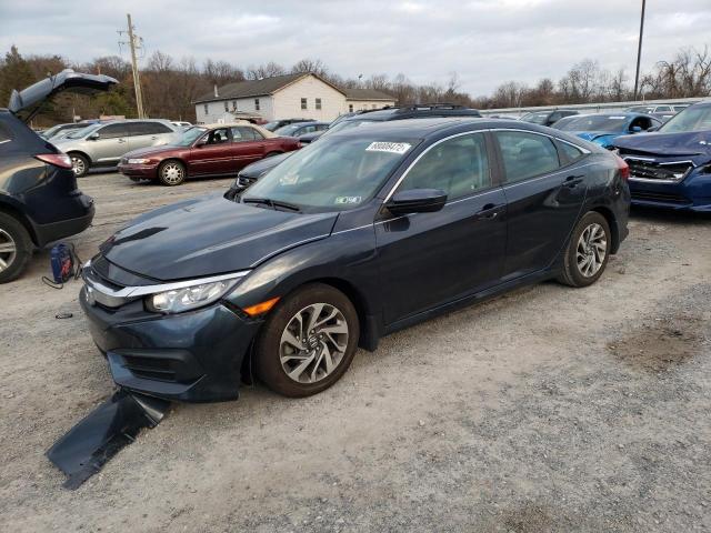 HONDA CIVIC EX 2018 with VIN 2HGFC2F74JH516636 - Photo from auction