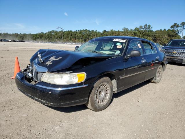 LINCOLN TOWN CAR E 2000 with VIN 1LNHM81W5YY784306 - Photo from auction