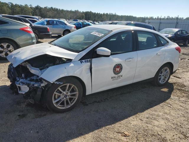 FORD FOCUS SE 2018 with VIN 1FADP3F21JL210359 - Photo from auction