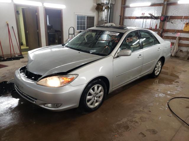 TOYOTA CAMRY LE 2003 with VIN 4T1BE30K93U702792 - Photo from auction