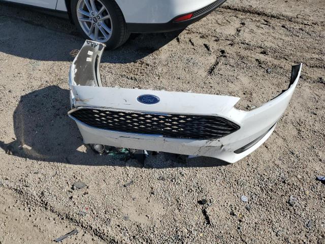 Photo 12 from auction – 2018 FORD FOCUS SE with VIN 1FADP3F21JL210359