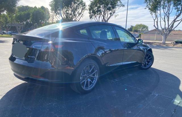 Photo 4 from auction – 2021 TESLA MODEL 3 with VIN 5YJ3E1EB8MF037089
