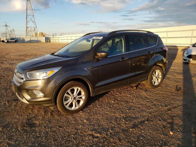 FORD ESCAPE SE 2018 with VIN 1FMCU9GD7JUB28644 - Photo from auction