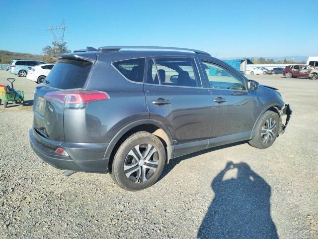 Photo 3 from auction – 2018 TOYOTA RAV4 LE with VIN JTMZFREV3JJ154891