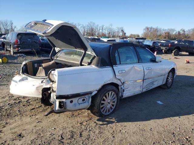 Photo 3 from auction – 2004 LINCOLN TOWN CAR E with VIN 1LNHM81W44Y674020