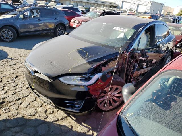 TESLA MODEL X 2018 with VIN 5YJXCAE2XJF100082 - Photo from auction
