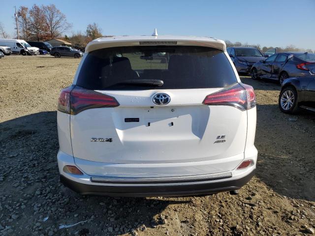 Photo 6 from auction – 2018 TOYOTA RAV4 LE with VIN JTMBFREV0JJ734486