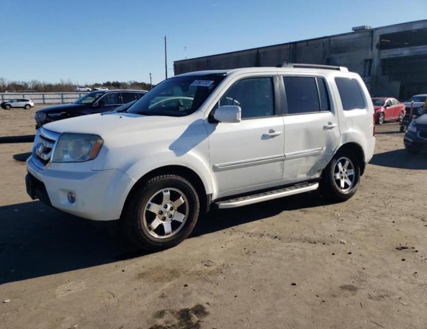 HONDA PILOT TOUR 2011 with VIN 5FNYF4H99BB059998 - Photo from auction