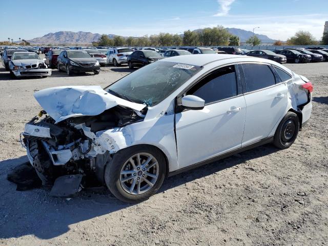 FORD FOCUS SE 2018 with VIN 1FADP3FE2JL304101 - Photo from auction