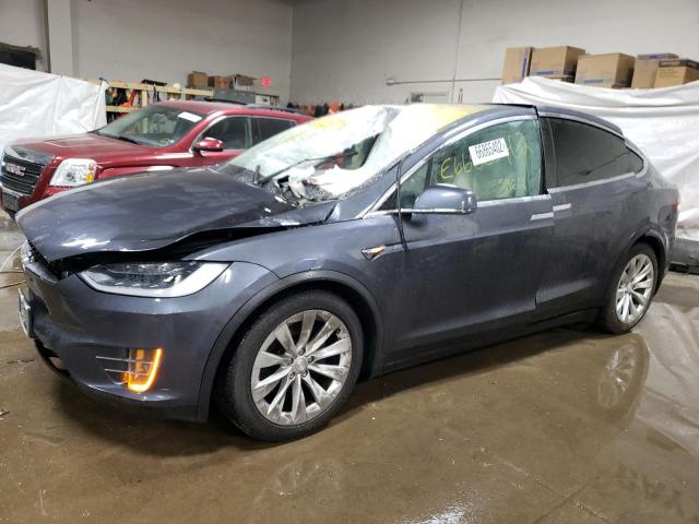 TESLA MODEL X 2018 with VIN 5YJXCAE24JF103995 - Photo from auction