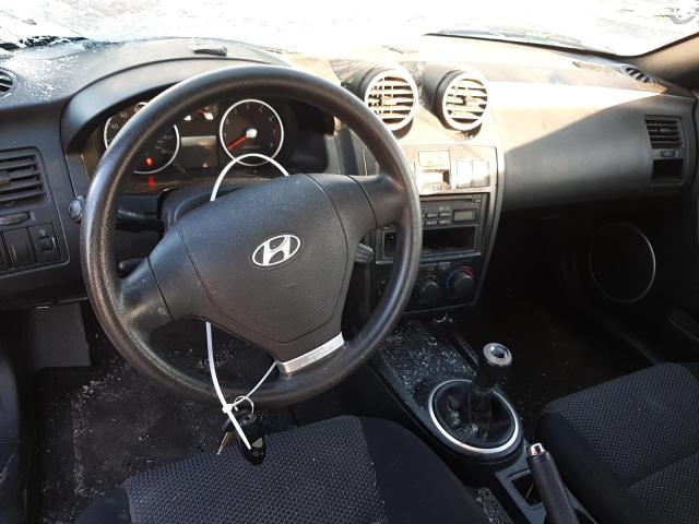 Photo 8 from auction – 2003 HYUNDAI TIBURON with VIN KMHHM65DX3U096928