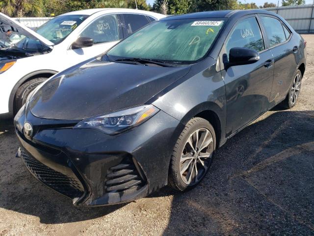 TOYOTA COROLLA L 2017 with VIN 5YFBURHE4HP634057 - Photo from auction
