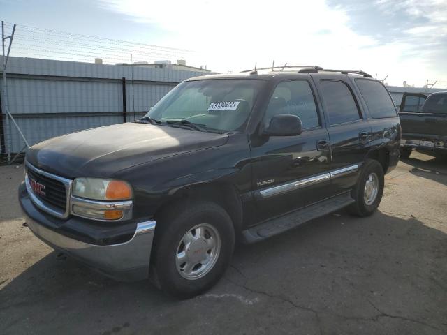 GMC YUKON 2002 with VIN 1GKEC13T22R311845 - Photo from auction