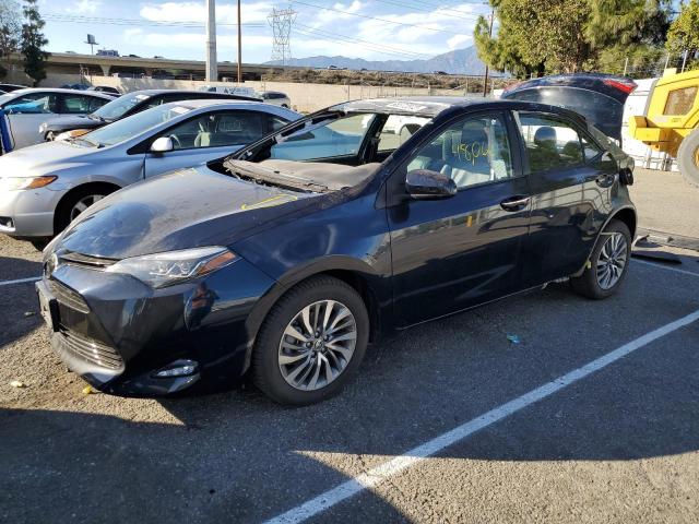 TOYOTA COROLLA L 2018 with VIN 5YFBURHE8JP759651 - Photo from auction