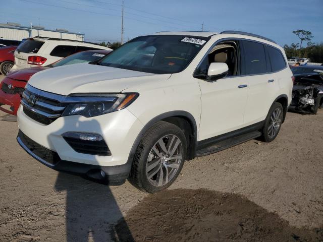 HONDA PILOT TOUR 2017 with VIN 5FNYF5H98HB021337 - Photo from auction