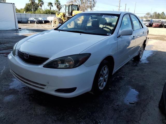 TOYOTA CAMRY LE 2004 with VIN 4T1BF32K24U065188 - Photo from auction