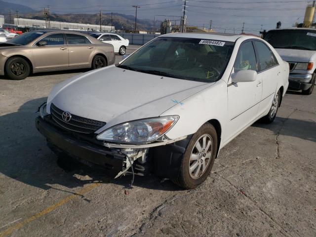 TOYOTA CAMRY LE 2004 with VIN 4T1BF32K34U070271 - Photo from auction